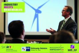 Poster zur Energiewende Veranstaltung Industry meets Renewables 2025 ein Redner und Zuhörer, im Hintergrund eine Leinwand